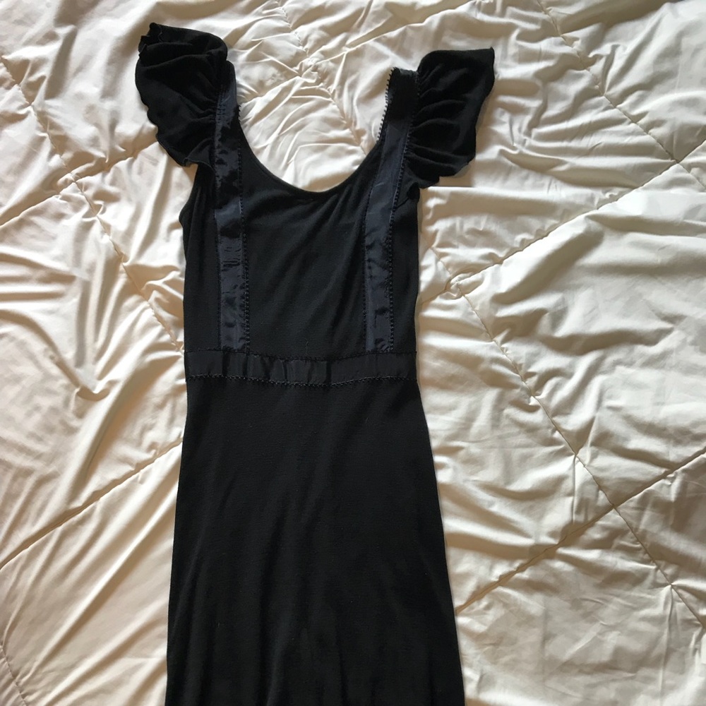 Black merino wool flutter sleeve dress.